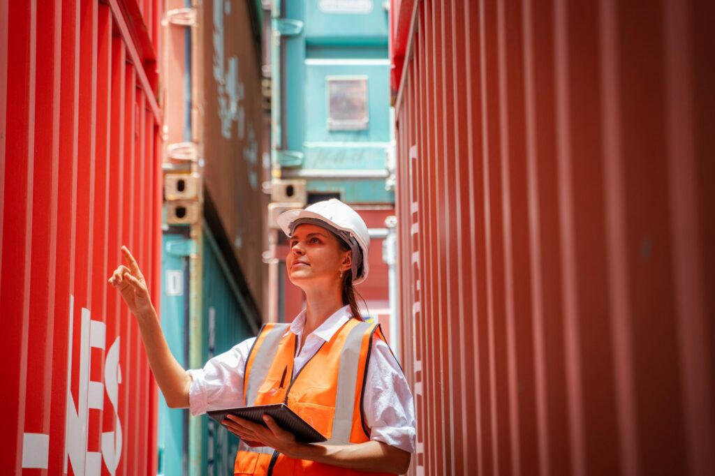 International shipping logistics,Logistics workers of forwarder with tablet inspect cargo.